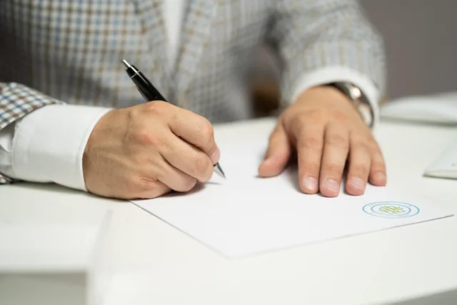 man, sign, paper, write, document, contract, signing, agreement, signature, signing document, signing contract, signing paper, sign, contract, contract, contract, contract, contract, signing, agreement, signature, signature. Bidding for Cardiff public sector retention software, step by step