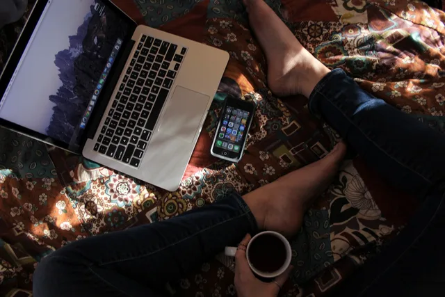 laptop, apple, keyboard, technology, mac, application, software, hardware, people, man, coffee cup, coffee, mug. Customer onboarding software for UK teams: what to check before signing